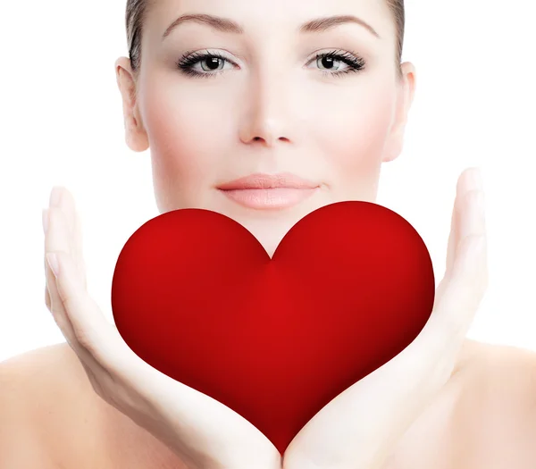 Beautiful woman holding big red heart — Stock Photo, Image
