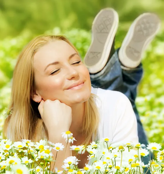Beautiful female enjoying flower filed — Stock Photo, Image