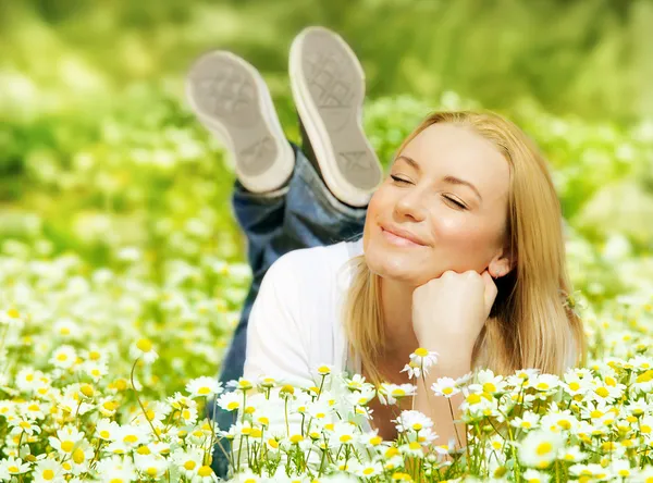 Beautiful female enjoying flower filed — Stock Photo, Image