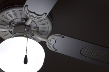 Old ceiling fan in white clipart