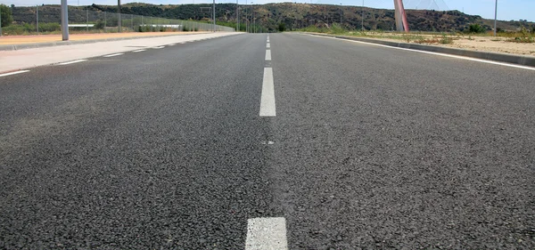 Straight tar road leading into — Stock Photo, Image