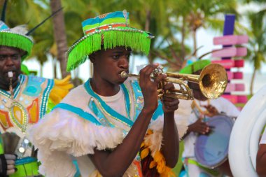 Junkanoo performer with trumpet clipart