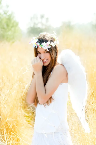 Angel girl in golden field with feather white wings — Stock Photo, Image