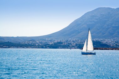 Sailboat sailing in Mediterranean sea in Denia clipart