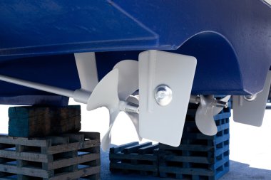 Gray painted propeller and steering with zinc anodes clipart