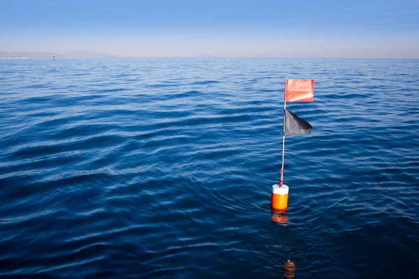 Stock image Longliner and trammel net buoy with flag pole