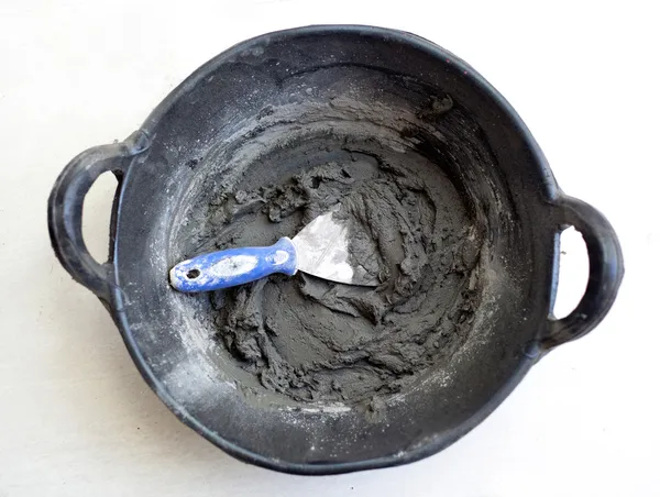 stock image Cement portland gray fresh mortar mix with spatula