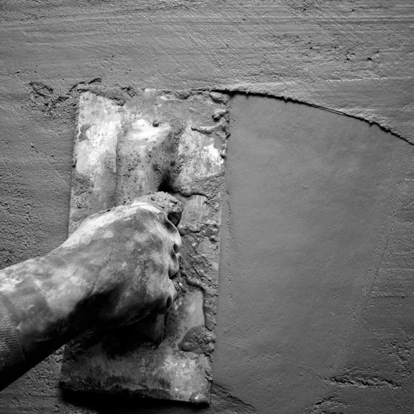 Trowel with glove hand plastering cement mortar — Stock Photo, Image