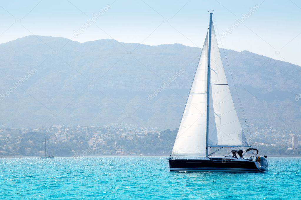 Sailboats sailing in mediterranean sea