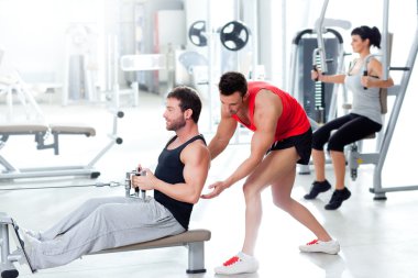 Gym man with personal trainer and fitness woman clipart