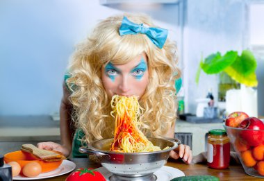 Blonde funny on kitchen eating pasta like crazy clipart