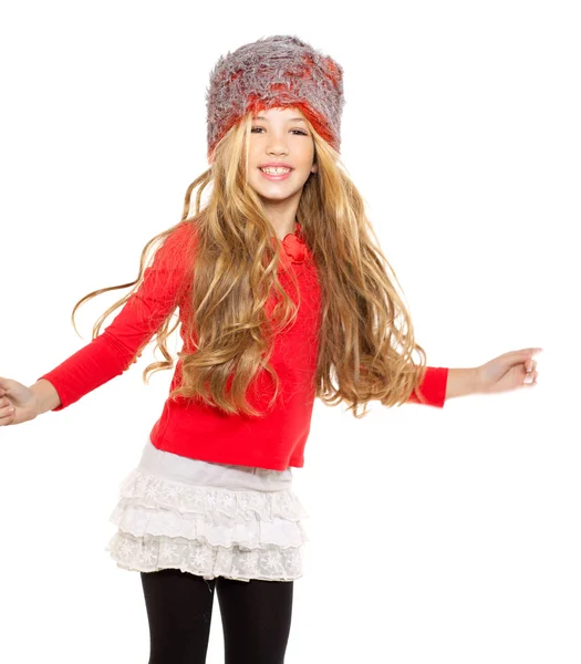 Kid girl winter dancing with red shirt and fur hat — Stock Photo, Image