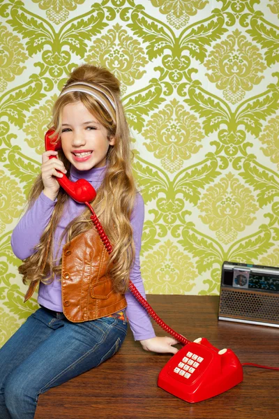 Kid girl retro talking busybody in red telephone — Stock Photo, Image