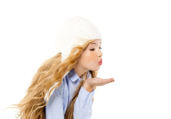 Beautiful winter kid girl blowing wind with lips — Stock Photo, Image