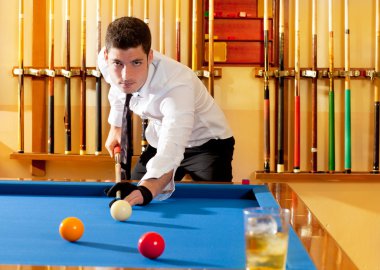 Billiard winner handsome man playing with cue and balls clipart