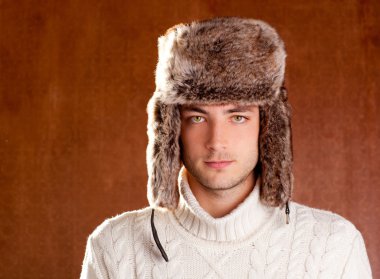 Autumn winter man with brown fur cup hat clipart