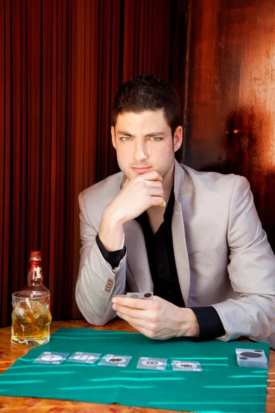 Latin handsome gambler man in table playing poker — Stock Photo, Image