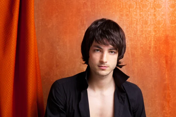 British indie pop rock look young man on orange — Stock Photo, Image