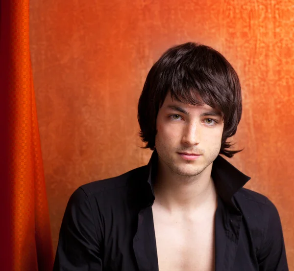 British indie pop rock look young man on orange — Stock Photo, Image