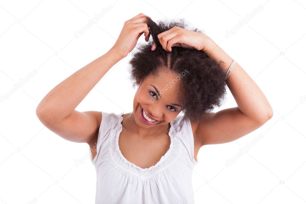 Young african american woman making braids