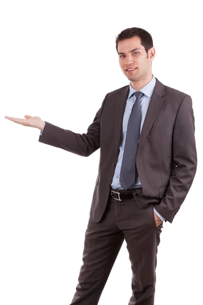 Portrait of a young caucasian business man holding something — Stock Photo, Image