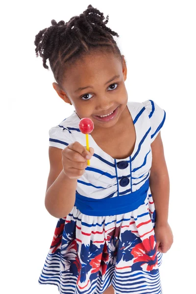 Portret van een schattig klein Afrikaans Amerikaans meisje met een lolly — Stockfoto