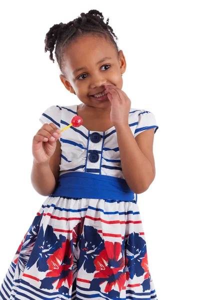 Retrato de una linda niña afroamericana con una piruleta —  Fotos de Stock