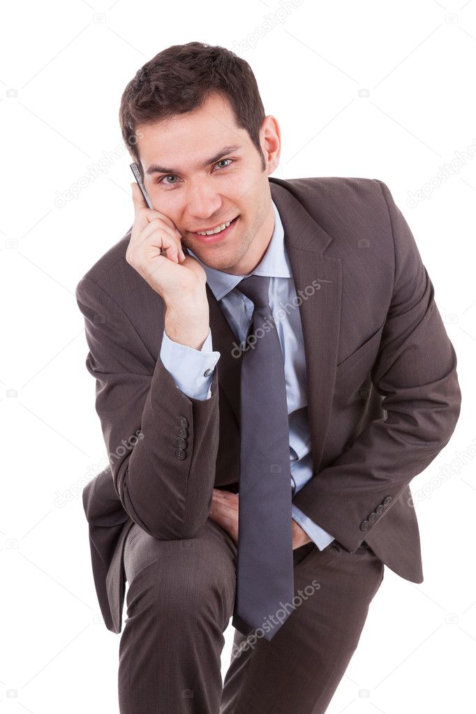 Portrait of a young caucasian business man using a mobile phone