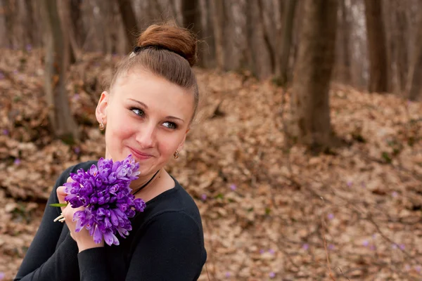 Girl with snowdrops — Stock Photo, Image