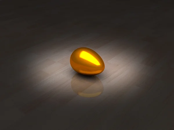 Goldenes Ei auf Holzboden in einem Lichtstrahl — Stockfoto