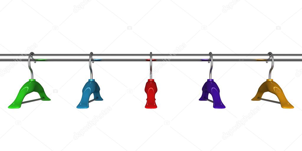 Colorful coat hangers on a clothes rail close up on white background