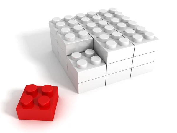 Ein individueller roter Baustein auf weißem Hintergrund — Stockfoto