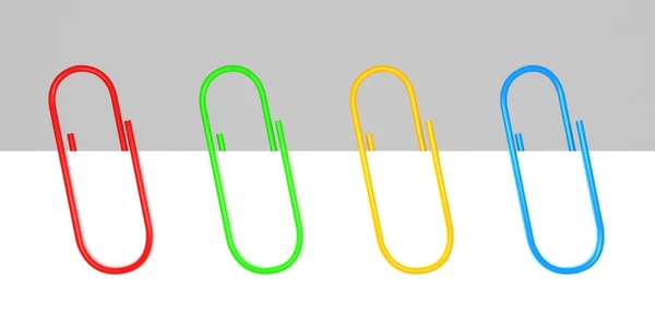 Colored office paper clips on white blank — Stock Photo, Image