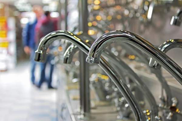 stock image New water tap faucets in plumbing shop