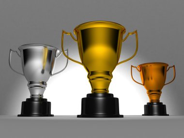 Award winner trophy cups on dark background