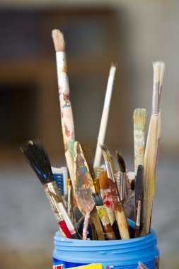 Container with painting pencils clipart