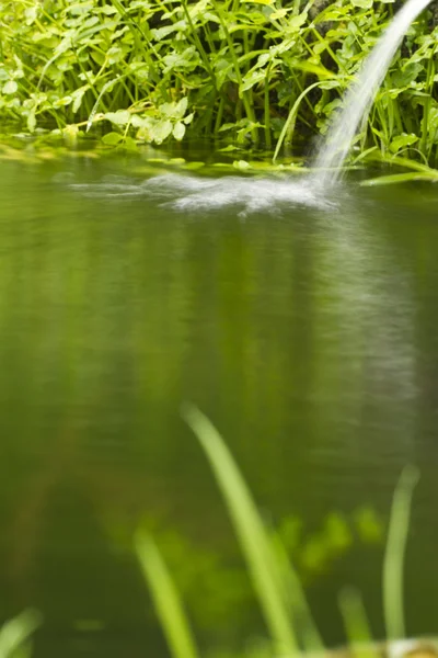 Small lake with waterfall — Stock Photo, Image