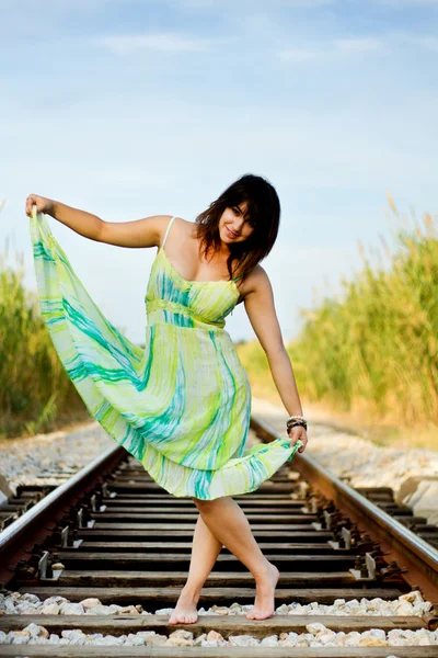 Beautiful girl on a railway — Stock Photo, Image