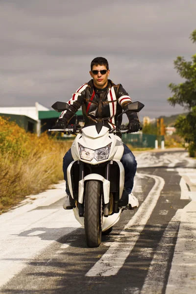 Man with a motorcycle — Stock Photo, Image