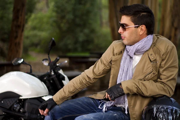 Man with a motorcycle — Stock Photo, Image