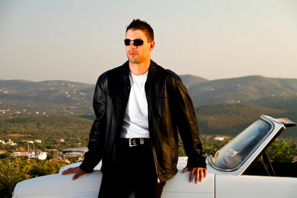 Man with white convertible — Stock Photo, Image