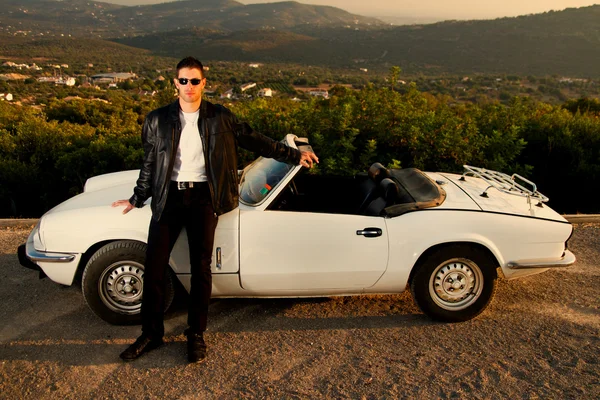 Man with white convertible — Stock Photo, Image