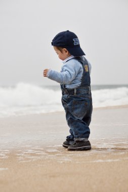 Young child walking on a beach