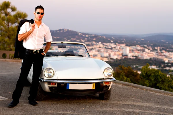 Man with white convertible — Stock Photo, Image