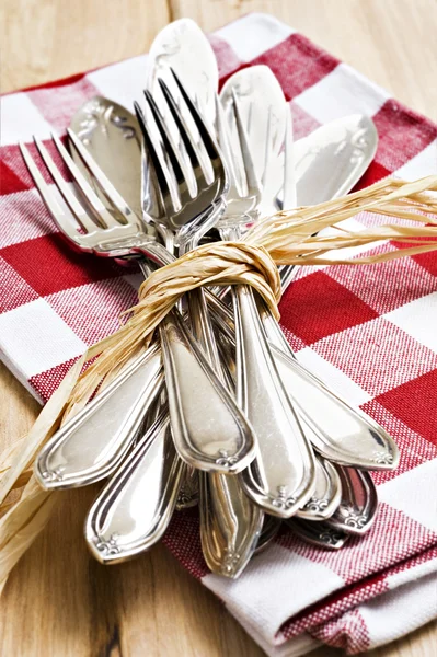 Collection of forks and knifes tied together — Stock Photo, Image