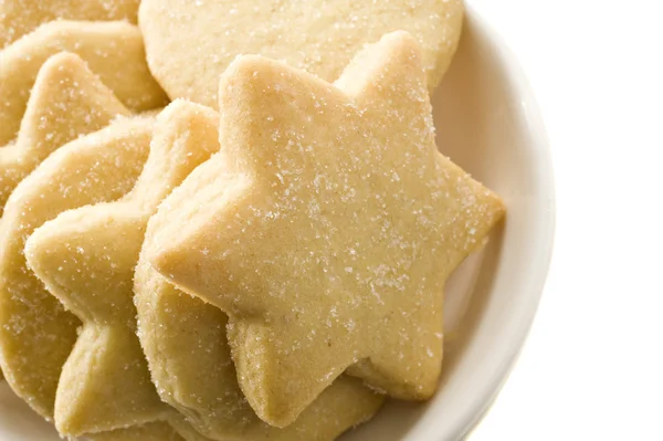 Sternförmige hausgemachte Kekse in einem weißen Teller — Stockfoto