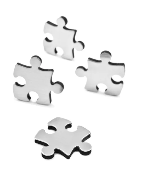 stock image Stainless steel puzzles pieces on white background