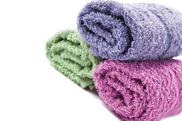 Fresh rolled up towels on a white background — Stock Photo, Image