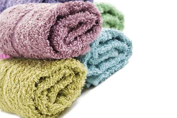 Fresh rolled up towels on a white background — Stock Photo, Image