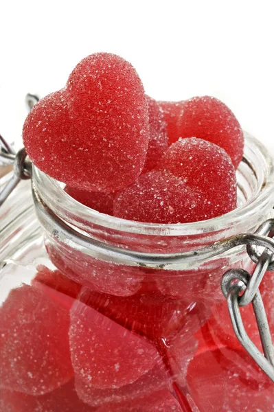 Red heart shaped jelly sweet in a glass jar — Stock Photo, Image